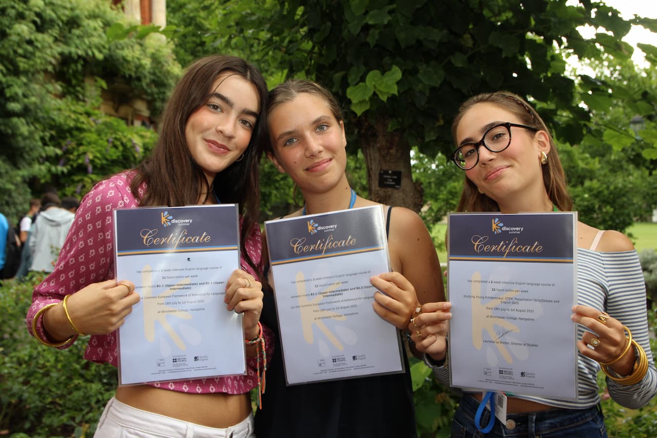 Students celebrating Trinity GESE and IELTS exam success at Winchester