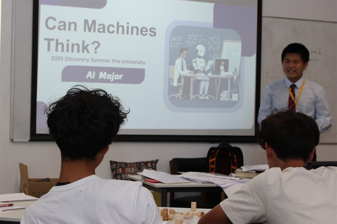 Ian and Discovery Summer Artificial Intelligence (AI) students in class in 2025